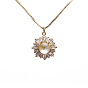 Gold plated sunflower pendant necklace with iridescent center stone and zircon halo