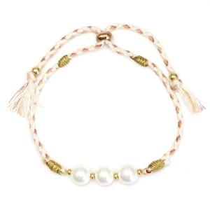 Adjustable woven bracelet with glass pearls and gold beads on a clean white background
