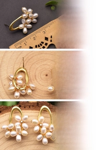 Detailed view of floral pearl earrings with 18K gold plating and natural freshwater pearls