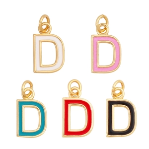 Detailed view of gold letter D pendants with colorful enamel inlays for custom necklaces
