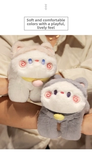 Detail of plush cat wristbands showing soft faux fur texture and cute embroidered faces