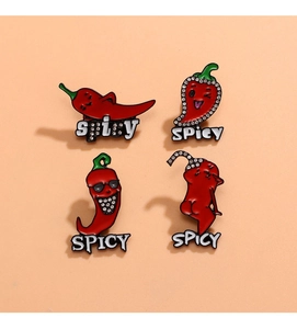 Detail view of four unique spicy red chili enamel pins with sparkling crystal accents