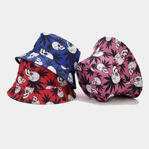 Detailed view of bucket hats featuring skull and hemp leaf patterns in three colors