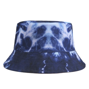 Close-up of tie-dye bucket hat showing blue and white fabric with reinforced brim stitching