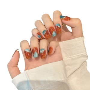 Amber marble press-on nails with blue glitter and square oval shape for elegant styling