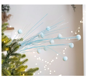 Close-up of light blue and silver glitter Christmas picks with soft flocking foam balls