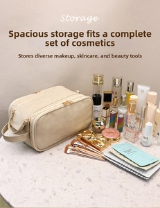 Macro detail of large beige travel cosmetic bag with double zippers and handle