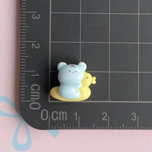 Mini resin accessories showing a blue bear and yellow duckling DIY craft decoration