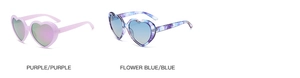 Detail view of heart-shaped sunglasses in purple and blue floral frames with gradient lenses