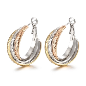 Three-tone interlaced hoop earrings with floral embossed texture in gold, silver, and rose gold