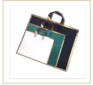 Set of frosted plastic shopping bags in black, green, and white with gold rim detail
