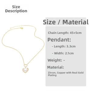 Detail view of heart pendant with cubic zirconia inlay and gold-plated chain size specs