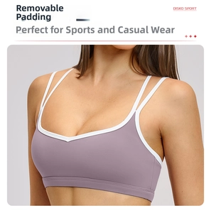 Detail of lavender sports bra with white trim, dual straps and removable pads feature