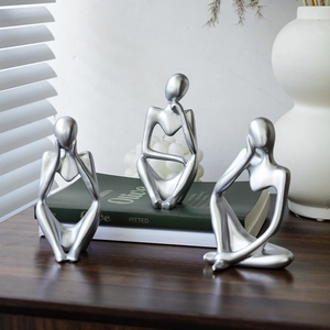 Set of three modern silver thinker sculptures for minimalist home desk decor
