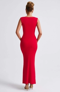Detailed back view of a slim-fit red sleeveless long dress with an open-back design