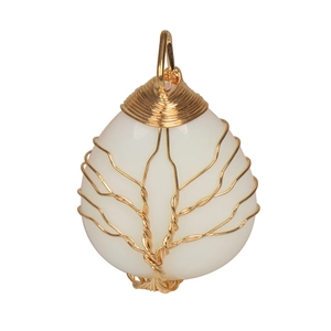 Detail of handmade gold wire-wrapped tree of life on milky white teardrop crystal pendant