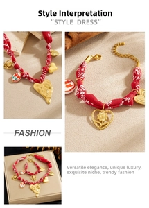 Detail of red paisley silk scarf jewelry set with golden heart and sunflower pendants
