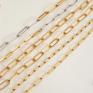 Macro detail of various gold and silver paperclip and textured link chain styles