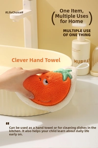 Close-up of carrot-shaped coral velvet hand towel with white hanging loop and cute embroidery