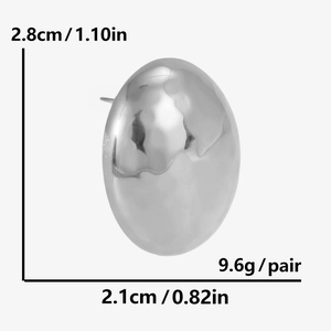 Macro detail of textured teardrop earrings with dimensions 2.8cm height and 2.1cm width