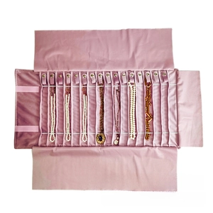 Pink velvet jewelry roll organizer with 14 metal hooks for necklace storage and protection