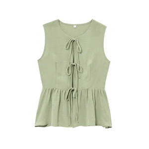 Detail of green sleeveless tie-front top featuring ruffles and crepe texture fabric