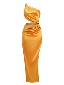 Detail of amber gold one shoulder satin dress with waist cutout and pleated texture