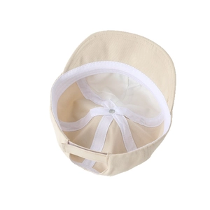 Inner view of cream cotton toddler sun hat with sweatband and adjustable back strap