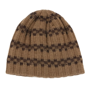 Close-up of winter knit beanie with brown striped pattern and ribbed texture details