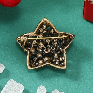 Macro shot of the vintage gold star brooch back structure with a secure safety pin fastener