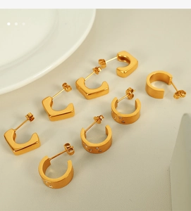 Detail view of 18k gold plated stainless steel C-shape and U-shape earrings set