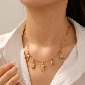 Gold plated stainless steel necklace with dolphin, turtle and starfish sea life charms