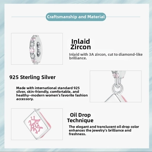 Macro detail of S925 silver Mahjong charm with pink enamel 'Fa' character and cubic zirconia