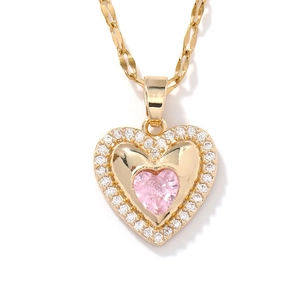 Gold heart pendant necklace featuring a pink gemstone center and micro-pave zircon border