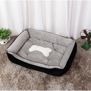 Detail view of thickened plush pet mat with bone pattern on a soft indoor rug