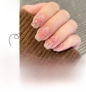 Detail of pink and purple firework pattern on long square press-on artificial nails