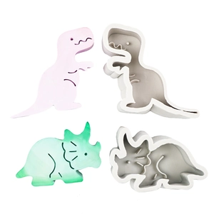 4-piece cartoon dinosaur silicone mold set with pink T-Rex and green triceratops shapes