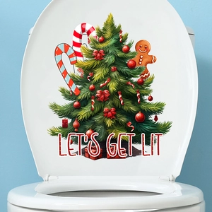 Detailed view of Christmas themed PVC decals featuring gingerbread man and tree on toilet lid