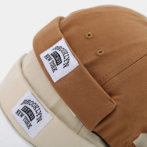 Vintage canvas docker hats in tan and cream with Brooklyn embroidery detail