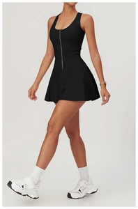 Side view of black athletic mini dress with front zipper and pleated A-line skirt