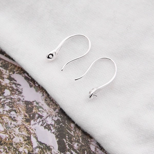 Macro shot of S925 sterling silver earring hooks with clear hallmark and DIY loop details