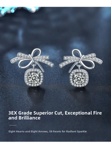 Macro shot of 925 silver bow earrings with 3EX cut moissanite and 58 facets