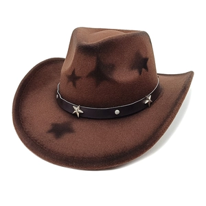 Brown wool cowboy hat with black star patterns and silver studs on a leather band