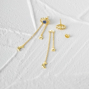Elegant gold S925 silver tassel earrings featuring enamel evil eye star and moon charms