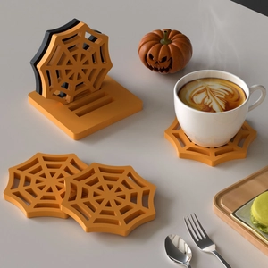 Halloween spider web coaster set with orange storage base and silicone cutout design