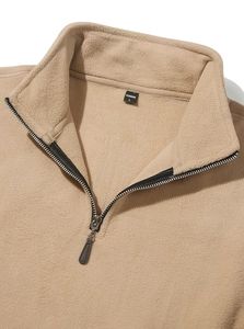 Detailed close-up of camel fleece hoodie collar with metal zipper and size L inner label