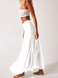 Detailed close-up showing delicate floral lace splicing on an elegant white satin skirt