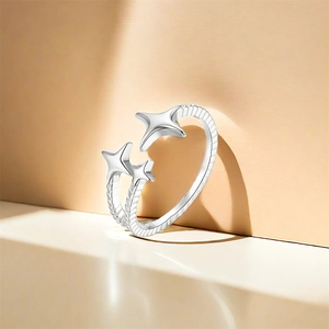 Macro detail of S925 sterling silver ring featuring triple stars and twisted rope band texture