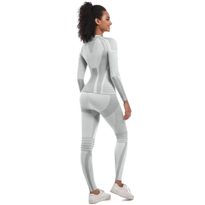Detail of light gray seamless knit yoga set showing back textures and breathable mesh panels