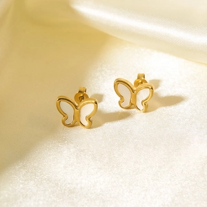 18K gold butterfly stud earrings with white mother of pearl on golden silk background